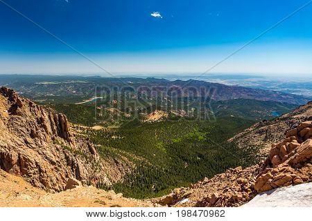 Pikes Peak is the highest summit of the southern Front Range of the Rocky Mountains. The ultra-prominent fourteener is located in Pike National Forest 12 miles west of downtown Colorado Springs. The mountain is named in honor of American explorer Zebulon