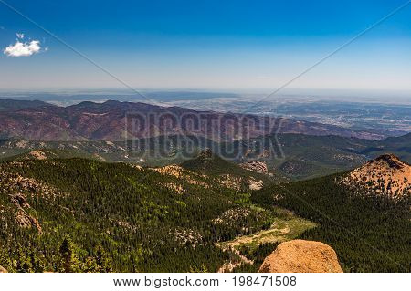 Pikes Peak is the highest summit of the southern Front Range of the Rocky Mountains. The ultra-prominent fourteener is located in Pike National Forest 12 miles west of downtown Colorado Springs. The mountain is named in honor of American explorer Zebulon