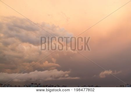 Sunset with clouds after the rain over dormitory area