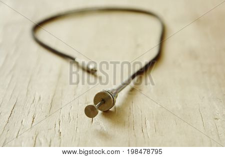 classic camera shutter cable released on wooden board
