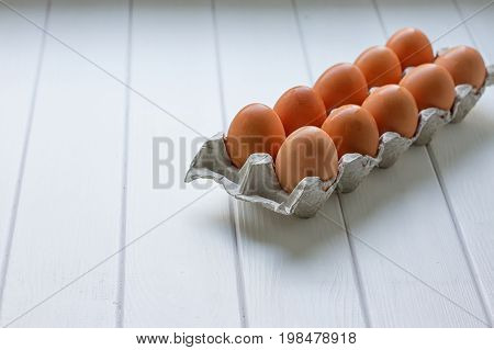 Eggs in the paper tray package on white background.