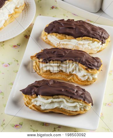 Sweet homemade eclair choux pastry with chocolate.