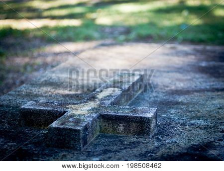 Grave Slab With Cross In Cemetery