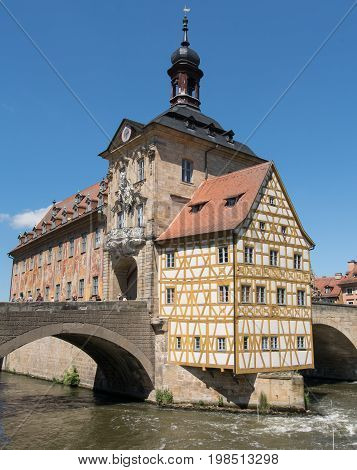 BAMBERG, GERMANY - MAY 26, 2017: Famous city hall of Bamberg located in the middle of the Regnitz river on May 26, 2017 in Bavaria, Germany