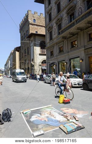 People Walking In Front Of A Street Artwork At Firenze