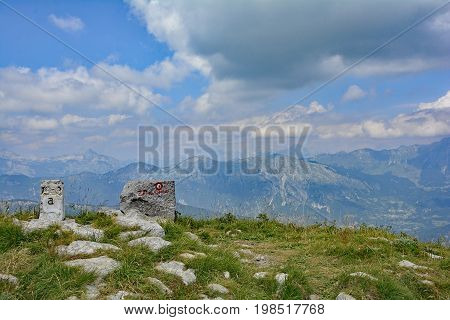 A stone marker on the peak of the Matajur mountain in Friuli Venezia Giulia north east Italy
