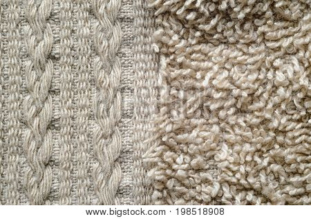 A macro shot of an element of beige color towel. Fleecy part and decorative element with braided pigtails. Texture is similar to the texture of a fleecy knotted-pile carpet.