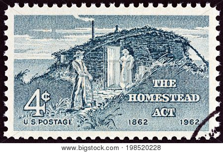 USA - CIRCA 1962: A stamp printed in USA issued for the centenary of Homestead Act shows Settlers, circa 1962.