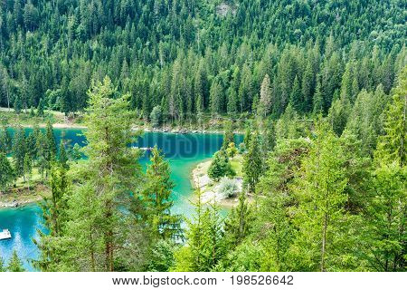 Caumasee in Switzerland lake with turquoise water for hiking and swimming