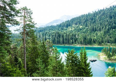 Caumasee in Switzerland lake with turquoise water for hiking and swimming