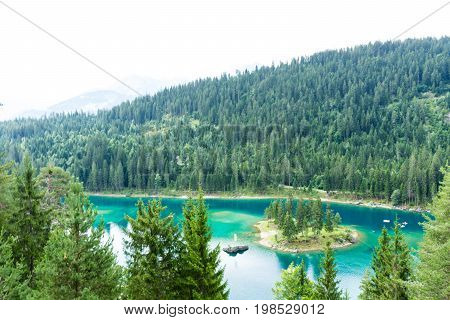 Caumasee in Switzerland lake with turquoise water for hiking and swimming
