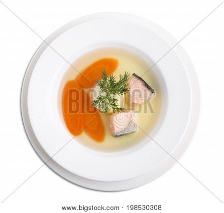 Delicious salmon soup with carrot and dill. Isolated on a white background.