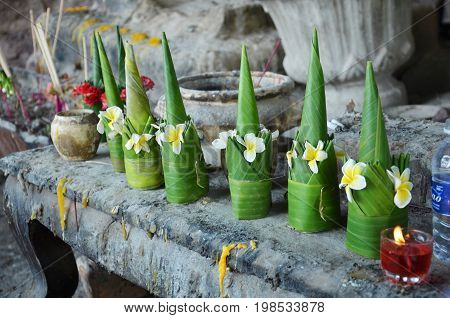 Sacrificial Offering Made From Banana Leaf And Flower Praying To Buddha And God At Vat Phou Or Wat P