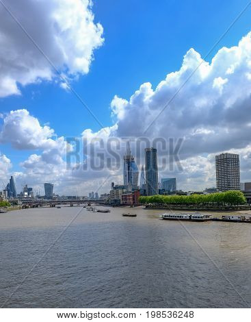 London skyline shot of famous new buildings in central London looking up the Thames River.
