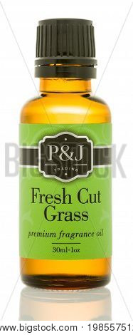 Winneconne WI - 6 August 2017: A bottle of P&J Trading fragrance oil in fresh cut grass scent on an isolated background.