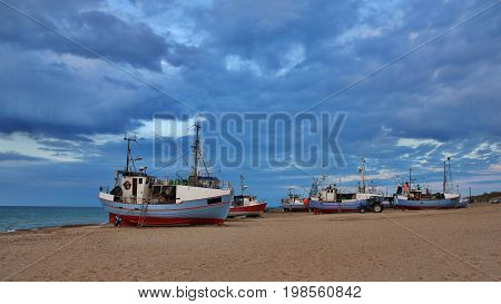 Evening at Thorup Beach Denmark. Fishing boats.
