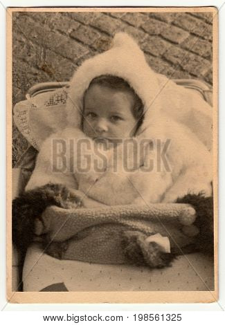 Hodonin, The Czechoslovak Republic - Circa 1940: Vintage Photo Shows Baby In Pram Baby Carriage .