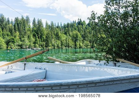 boats on crestasee lake ready to use in flims switzerland