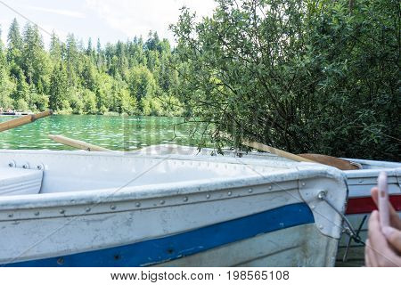 boats on crestasee lake ready to use in flims switzerland