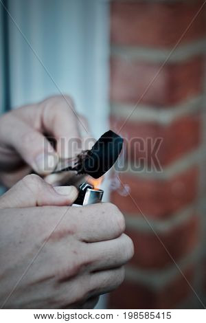 Man Burning Sisha