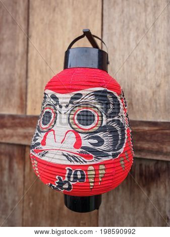 Japanese Lantern on vintage wood wall .
