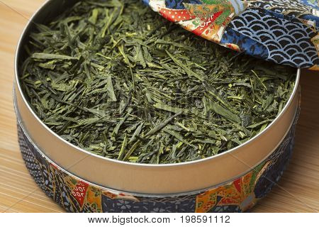 Blue box with Japanese green tea leaves