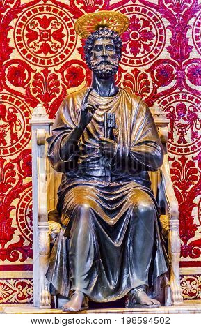 ROME, ITALY - JANUARY 18, 2017 Ancient Saint Peter Keys Bronze Sculpture Statue Saint Peter's Basilica Vatican Rome Italy. Statue from 1200s. Travelers traditionally touch foot for luck.