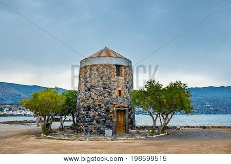 Ancient Windmill On Kalydon Peninsula Near Agios Nikolaos, Crete, Greece