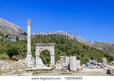 Ancient city Sagalassos ruins columns, sculpture and big stones