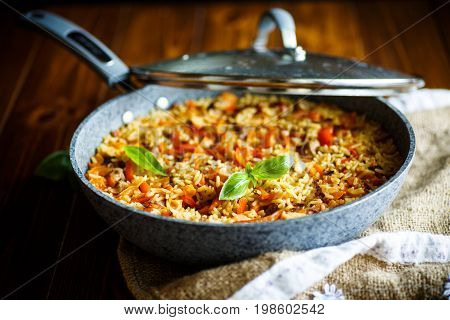 Pilaf with beef, carrots, onions, garlic, pepper and cumin. A traditional dish of Asian cuisine.