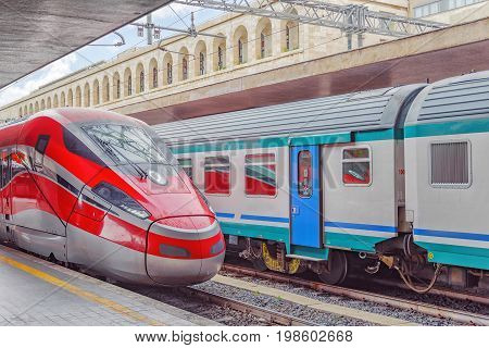 Modern high-speed passenger train stand on the railways station.