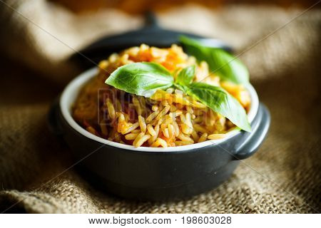 Pilaf with beef, carrots, onions, garlic, pepper and cumin. A traditional dish of Asian cuisine.