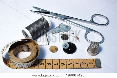 Sewing thread coils needles needle threader scissors push pins thimble tailor's measure