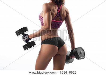 Rearview shot of a sexy female athlete exercising with weights showing off her perfect toned body isolated on white copyspace sport motivation athletics determination fitness lifestyle.