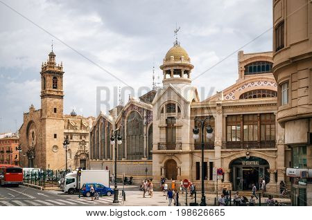 Valencia Spain - June 3 2017: Exterior of Mercado Central Market and Santos Juanes Church in Valencia Spain