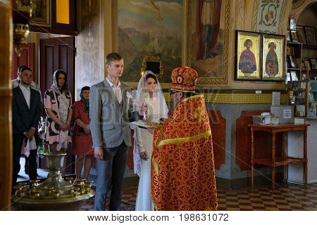 Alchevsk, Ukraine - April 28, 2017: Wedding Ceremony For Newlyweds In The Church