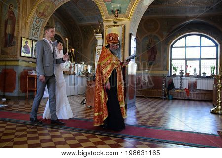 Alchevsk, Ukraine - April 28, 2017: Wedding Ceremony For Newlyweds In The Church