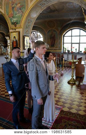 Alchevsk, Ukraine - April 28, 2017: Wedding Ceremony For Newlyweds In The Church
