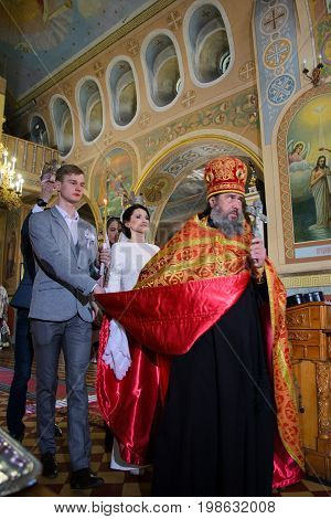 Alchevsk, Ukraine - April 28, 2017: Wedding Ceremony For Newlyweds In The Church