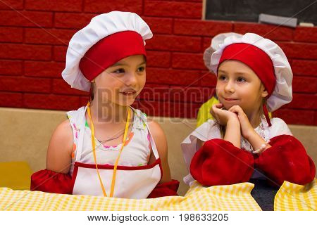 Alchevsk, Ukraine - July 23, 2017: School Cook For Children. Meat Rolls With Cheese Are Prepared.