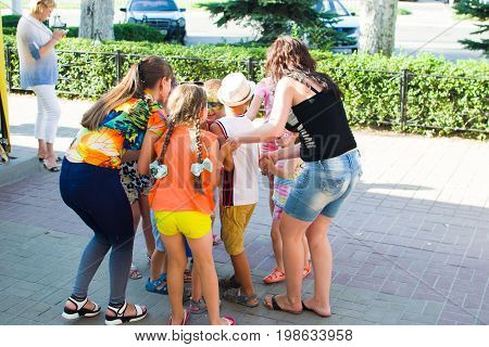 Alchevsk, Ukraine - July 27, 2017: Happy Children Play With Animators In Summer