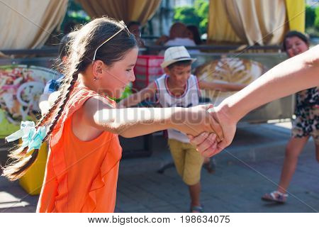 Alchevsk, Ukraine - July 27, 2017: Happy Children Play With Animators In Summer