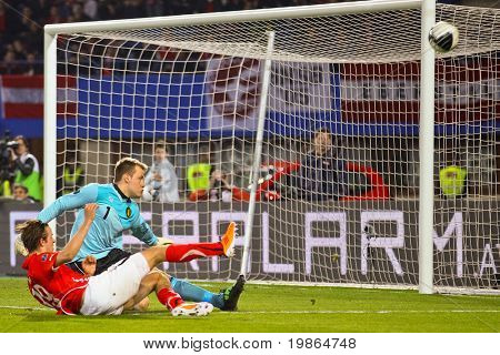 VIENNA,  AUSTRIA - MARCH 25: Austria loses to Belgium 0:2 in a qualifying match for EURO 2012 on March 25, 2011  in Vienna, Austria. Shown are Martin Harnik (#19, AUT) and Simon Mignolet (#1, BEL).