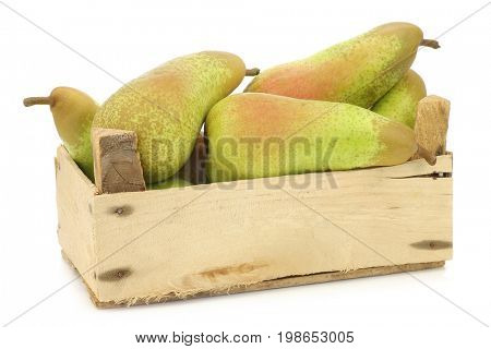 fresh juicy abate pears in a wooden box on a white background