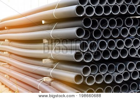 Plastic pipes in stock of finished products stacked in packs