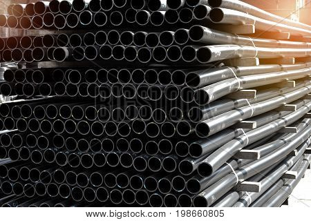 Plastic pipes in stock of finished products stacked in packs
