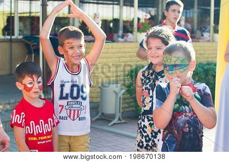 Alchevsk, Ukraine - July 27, 2017: Happy Children Play With Animators In Summer