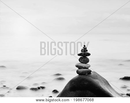 Rounded Colorful Stones Stand In The Form Of Pyramid Big Rounded Stone At Sea