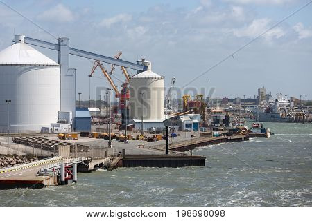 HARBOR CALAIS FRANCE - JUNE 07 2017: Harbor Calais with carriers and storage silo's