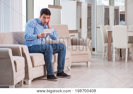 Young man shopping in furniture store